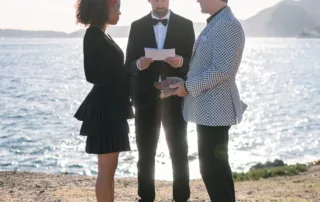 The bride and groom facing each other during their renew of vows