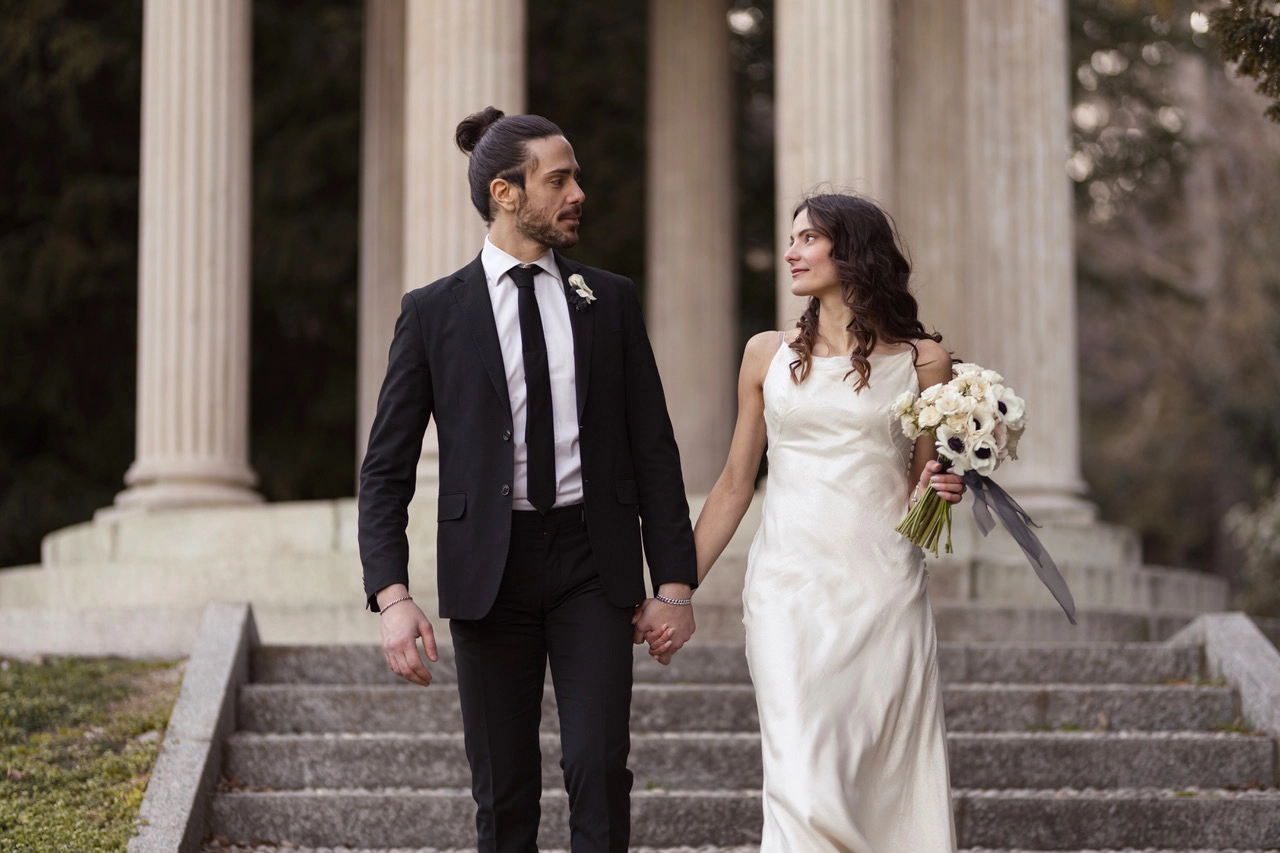they walk hand to hand after the ceremony in lake Come