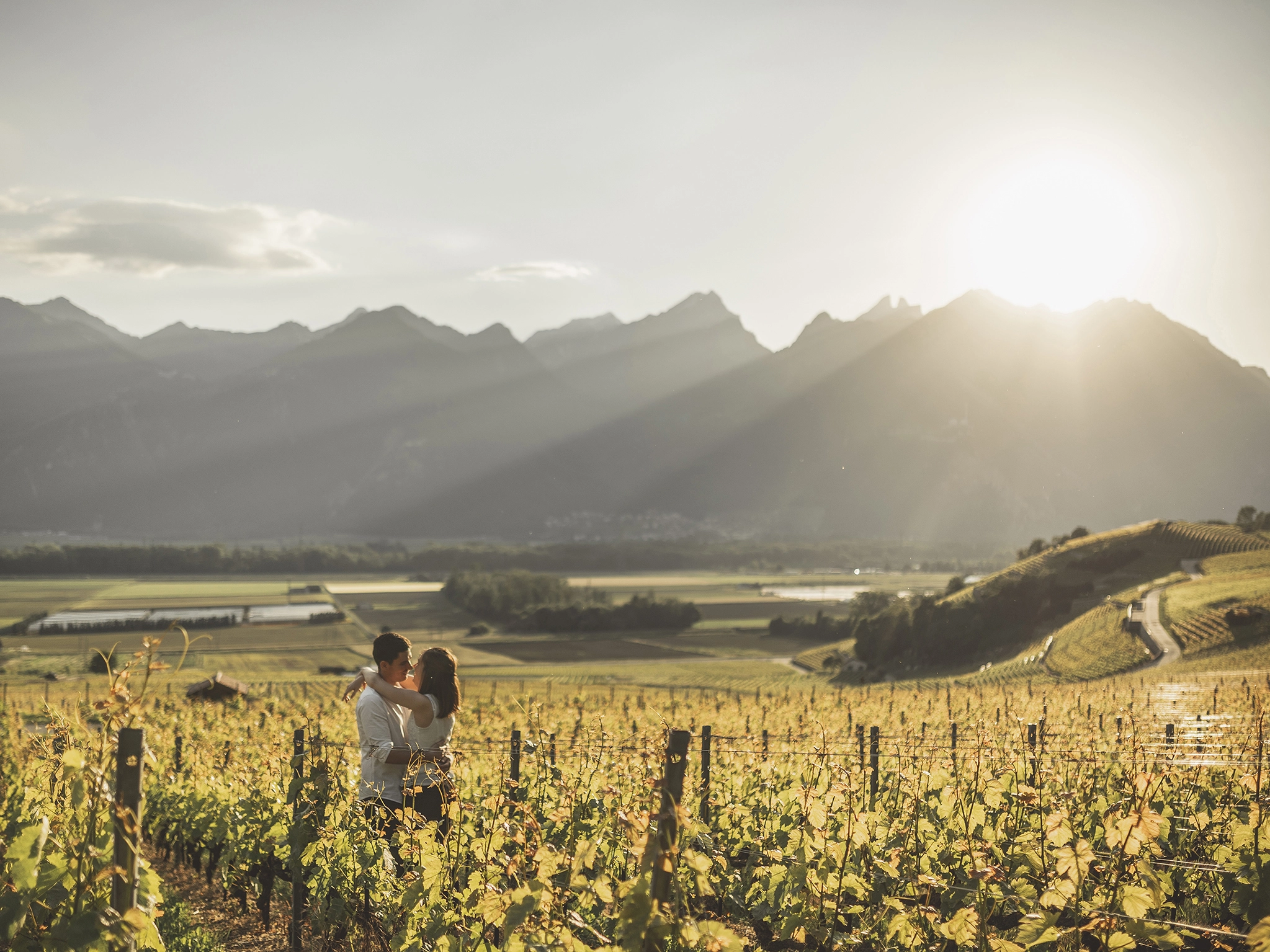 Switzerland wedding package and elopement The couple in a vineyard in Switzerland with Backlight