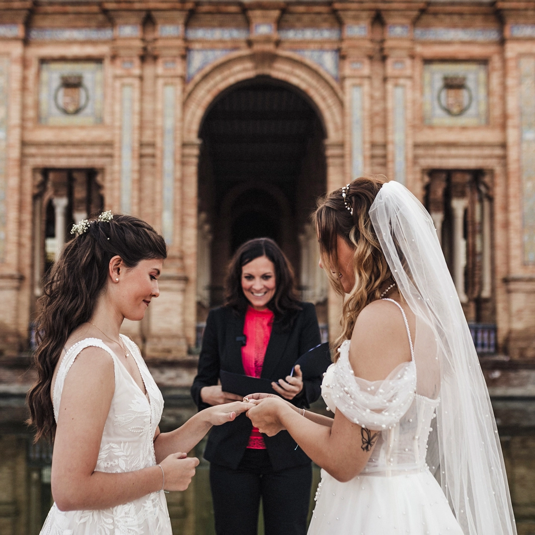 lesbian wedding in europe The 2 brides exchanging their vows and sliding the ring