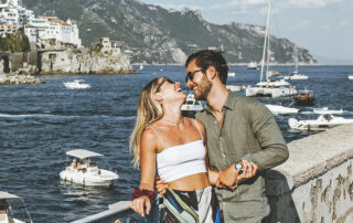 the couple on a balcony after their renew of vows in Amalfi