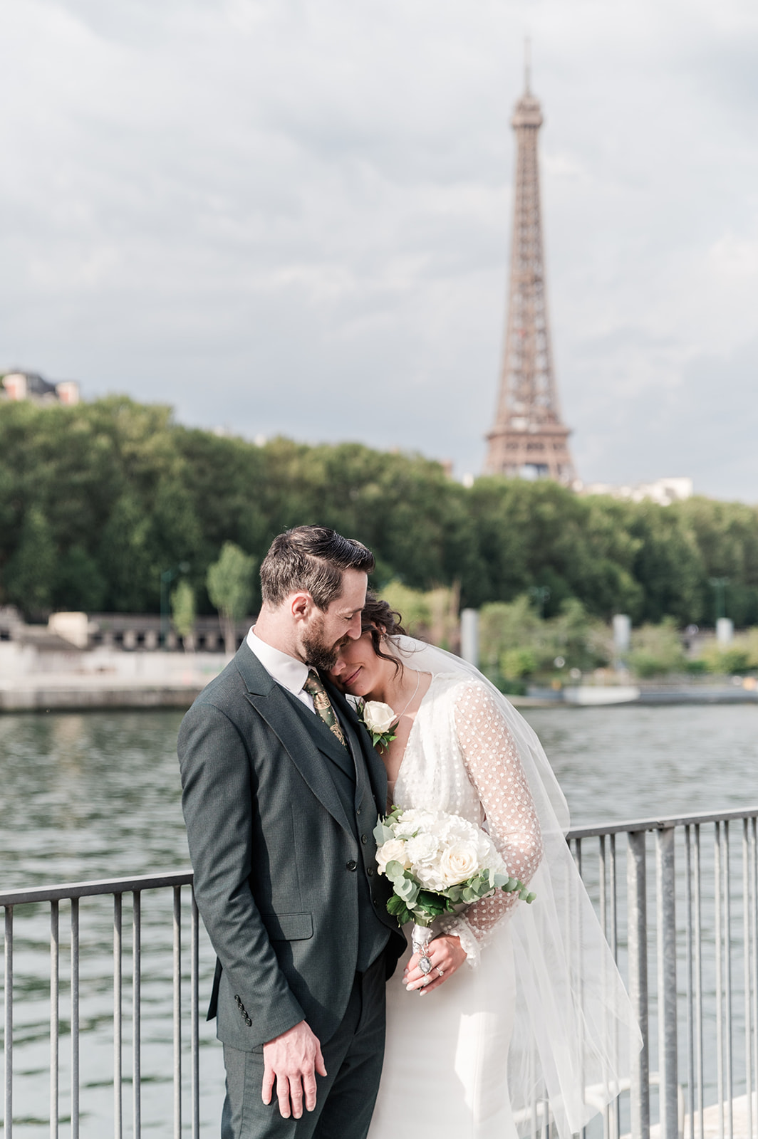 a peaceful moment for bride and groom at the river bank Destination wedding in Paris - Love Gracefully