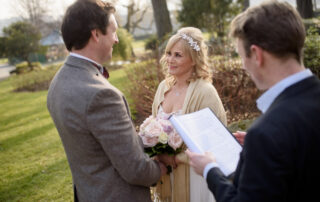 bride is smiling during their vows