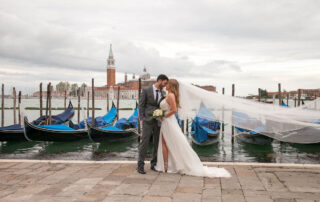 A great shot for the couple in front of the canals and the gondolas as backdrop
