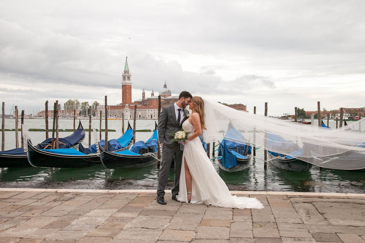 016-elopement in venice-91 A great shot for the couple in front of the canals and the gondolas as backdrop