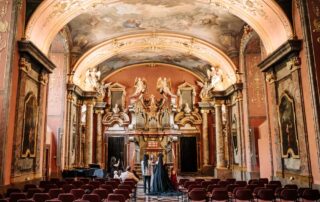 The couple looking at the decoration inside the balroom of the Clementinium