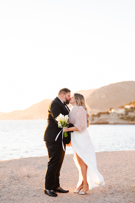 A couple kissing at Sunset over the blue see of French riviera