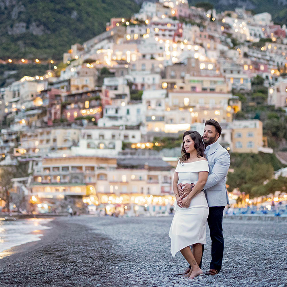 vows renewal in Amalfi coast, Positano-01 – 2836 The photo on the beach of Amalfi ocasxt , the couple embraced each other with the village in the backdrop
