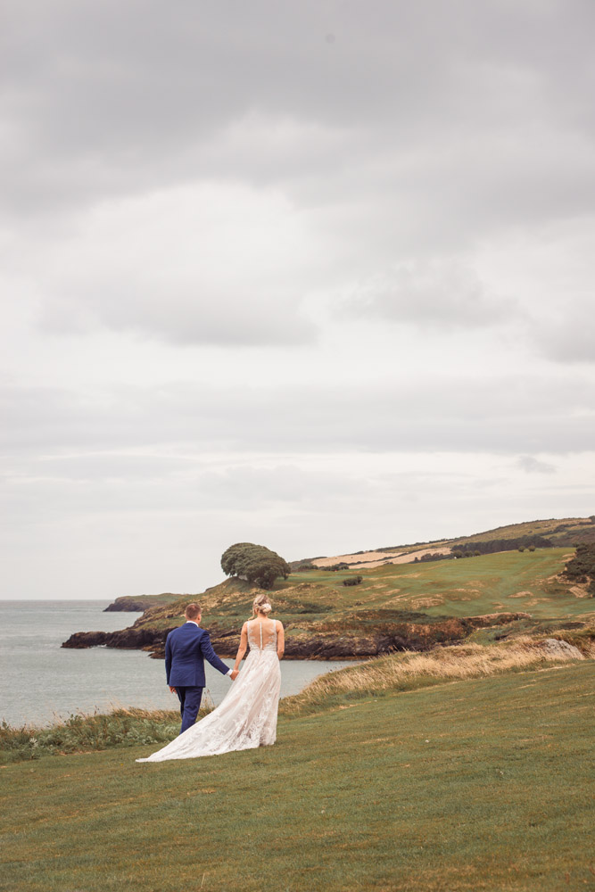 elopement wedding in Ireland-207-084 The bride and groom enjoying the moment after the ceremony for a walk along the cliff edge