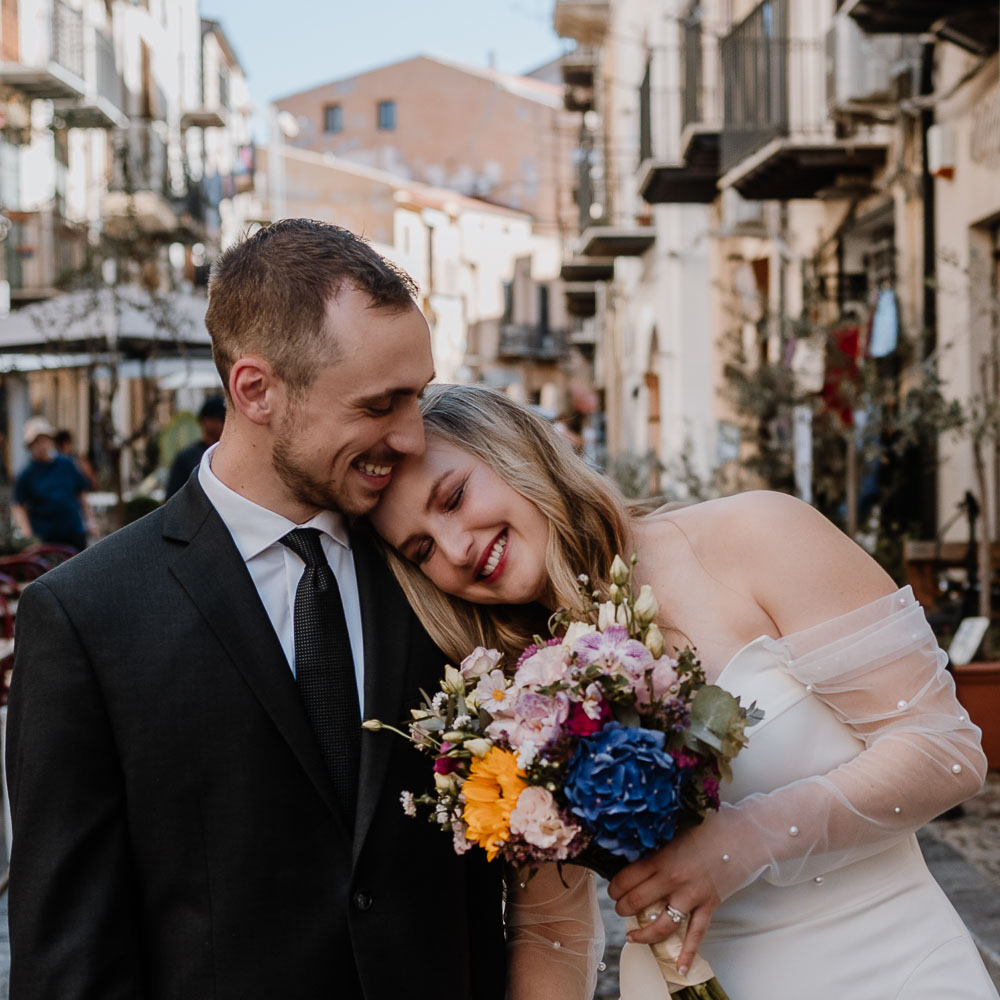 photoshoot for wedding in Sicily 5-2-001 the couple takes a walk in the old street of the village of Palermo after their elopement