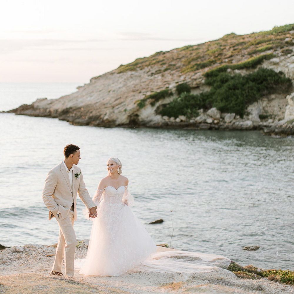 wedding in Crete-485-001 bride and groom walking at sunset in Crete by the see