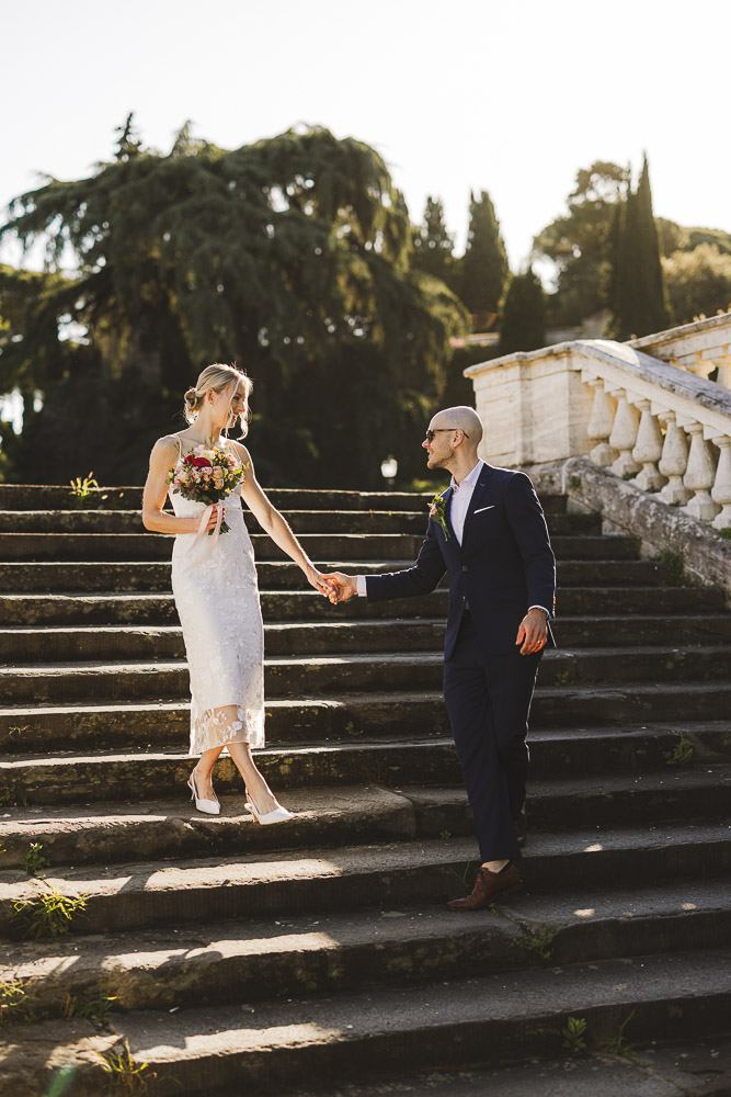 The bride and groom in the stairs after the ceremony in Fmlorence