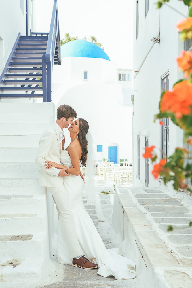 The couple posing in the old street in Mykonos