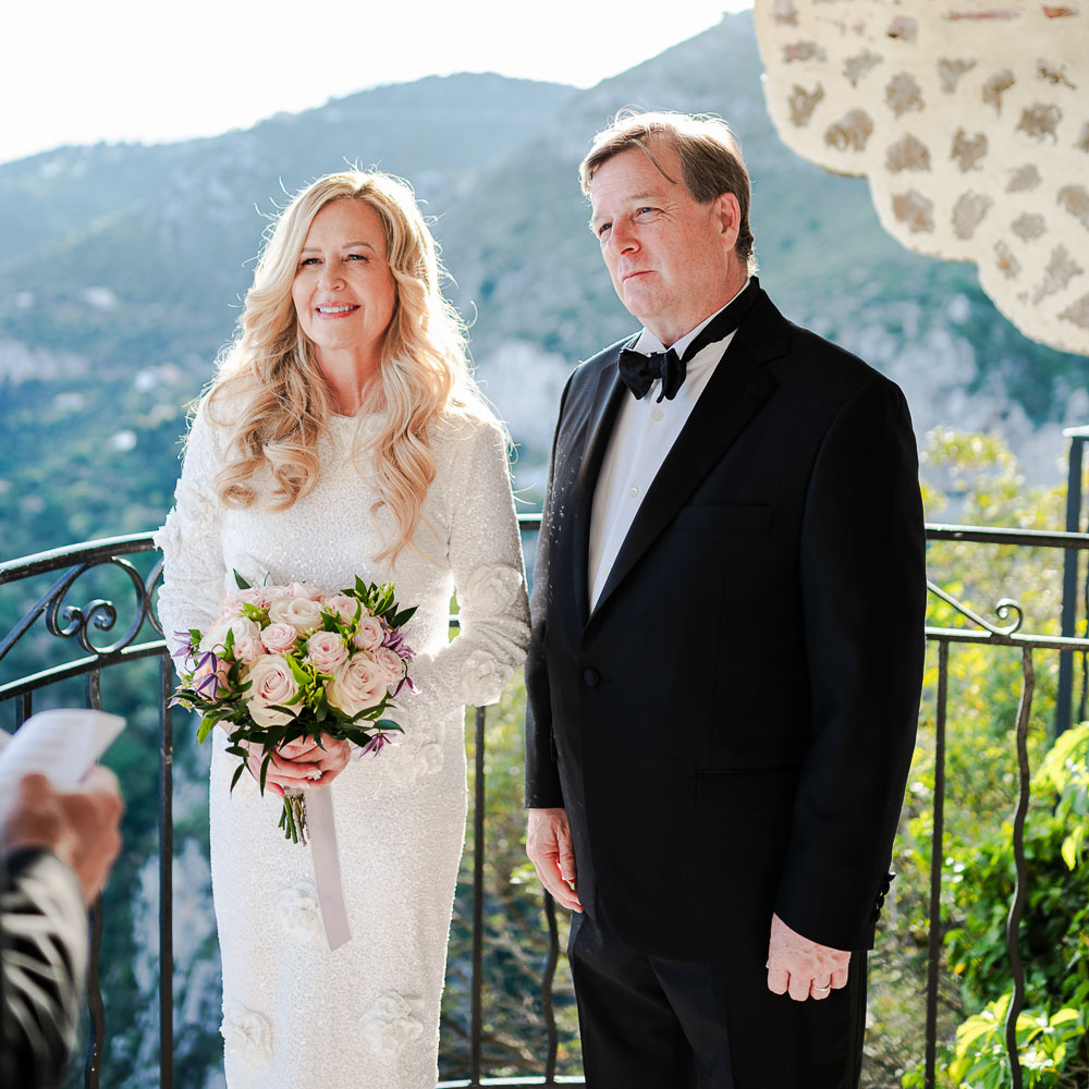 The couple during the ceremony of vow renewal in Eze, French riviera, on a balcony