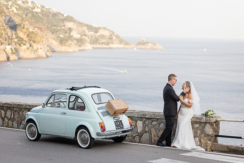 The bay area of Positano in winter with couple on the road