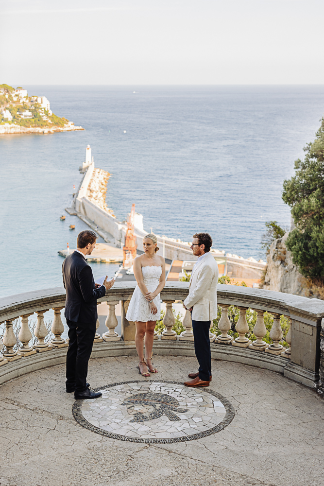 The couple and celebrant during the ceremony above the Nice harbour